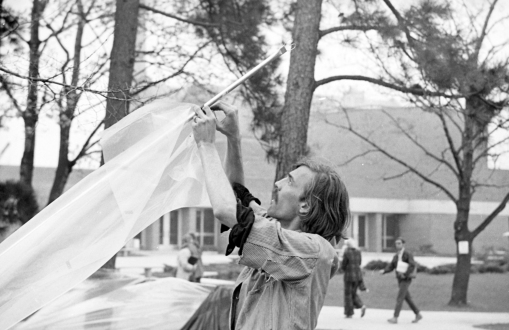 Man assembles a tent at the Peoples' Park in 1970